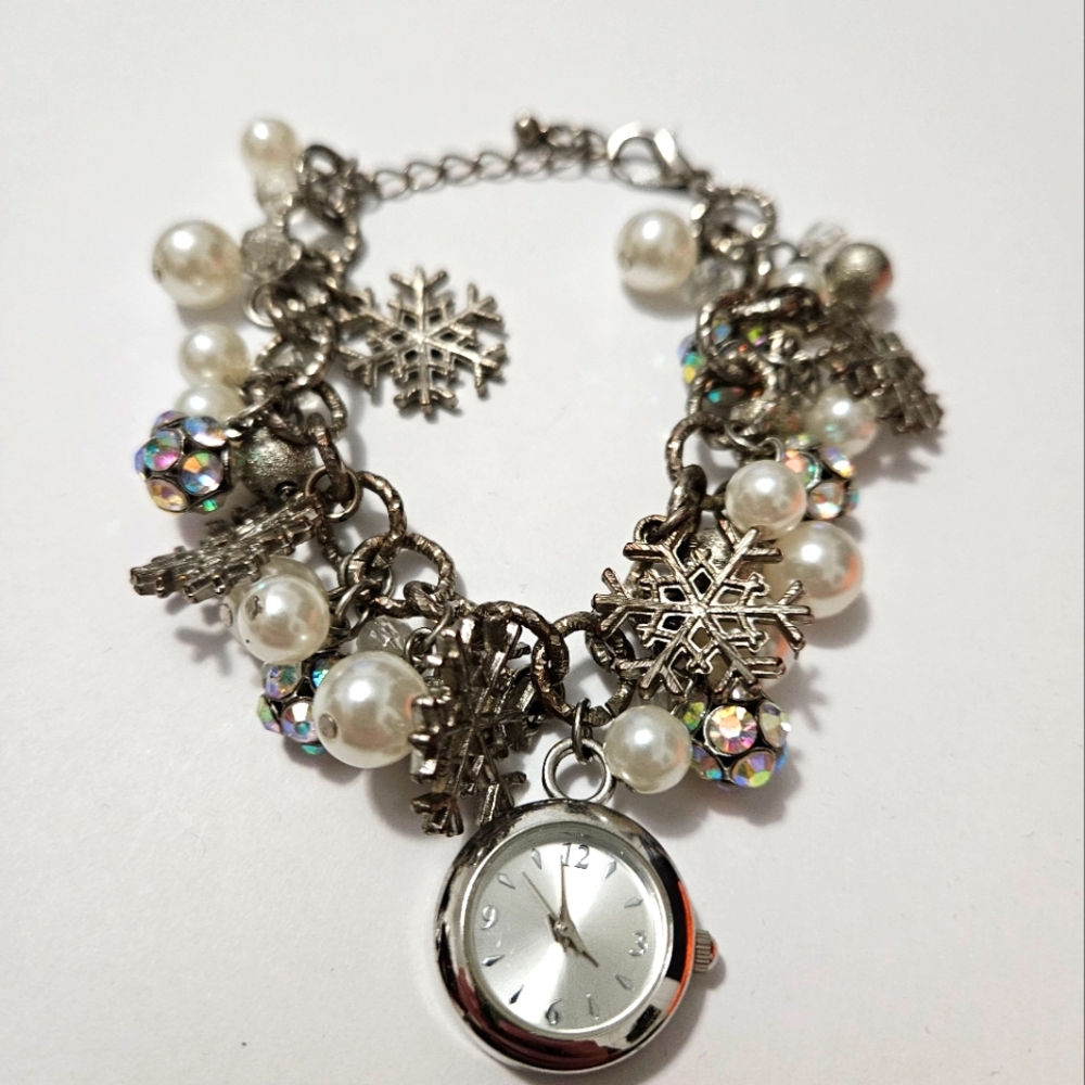 Beautiful Charm Bracelet with Snowflakes and Silver Tone Timepiece